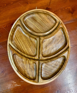 A wooden snack plate and key holder